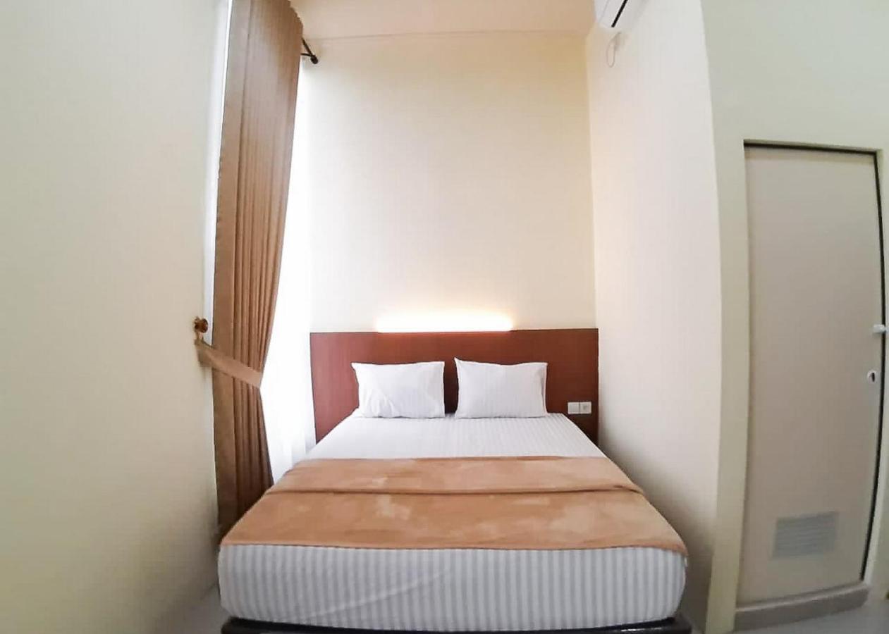 Отель Reddoorz Syariah Near Transmart Jambi 2 Paalmerah Экстерьер фото